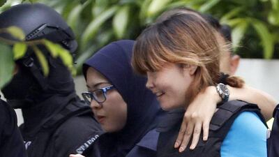Vietnamese suspect Doan Thi Huong, right, who was arrested in connection with the death of Kim Jong-nam, being escorted by police officers as she leaves a court house in Sepang, Malaysia on April 13, 2017. She is one of two women accused by authorities of swiping Kim's face with VX nerve agent. Vincent Thian/AP Photo