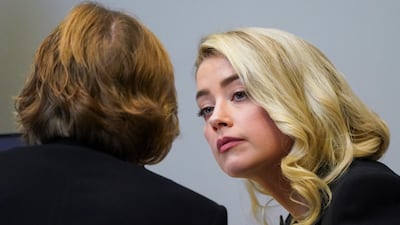 Heard talks listens to her lawyer Elaine Bredehoft. AP