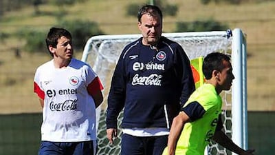 Marcelo Bielsa, the Chile coach, observes his side in training as they make late preparations for today's game with Honduras.