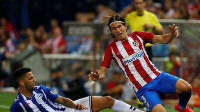 Atletico Madrid's Filipe Luis, right, and Alaves' Edgar in action. (Javier Barbancho/Reuters)