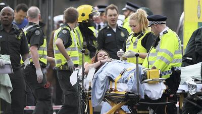 A member of the public is treated by emergency services near Westminster Bridge and the Houses of Parliament following a terror attack in 2017. Carl Court/Getty Images