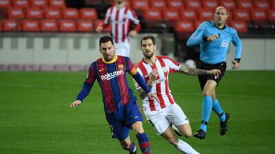 Barcelona's Lionel Messi under pressure from Athletic Bilbao midfielder Dani Garcia. AFP