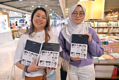 Malaysian BTS fans Audrey, left, and Aqilah at the Kyobo bookstore in Gwanghwamun, Seoul. AFP