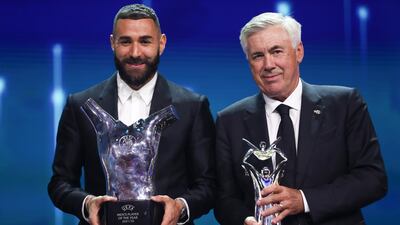 Real Madrid attacker French Karim Benzema and manager Carlo Ancelotti pose with their awards during the Uefa Champions League group stage draw in Istanbul on August 25, 2022. EPA