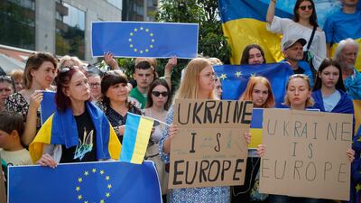 Supporters of Ukraine's EU membership demonstrate outside the summit venue in Brussels. EPA