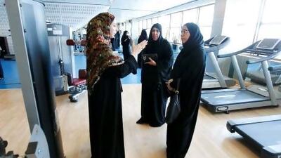 Dr. Hanan Radwan gives Sharjah FNC member Sheikha Al Owais and Sheikha Eisa Ghanem, Umm Al Qaiwain FNC member, a tour of a campus gym facility while walking around UAE University in Al Ain. Sarah Dea / The National