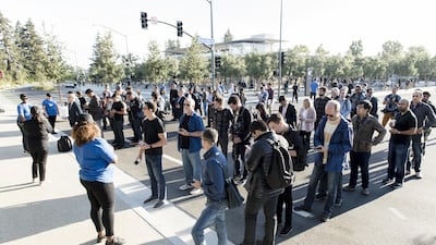 Attendees line up for check-in ahead of the Apple event. Bloomberg