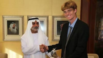 Sheikh Nahyan bin Mubarak, Minister for Culture, Youth and Community Development presents the annual natural history award to Oscar Campbell , a teacher at the British School Al Khubairat and bird conservationist, at his majlis in Abu Dhabi. Pawan Singh / The National