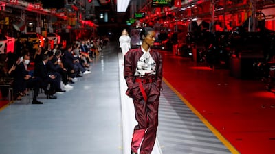 A model walks the runway at the fashion debut of the first co-ed Ferrari collection at Ferrari Factory on June 13, 2021 in Maranello, Italy. Reuters