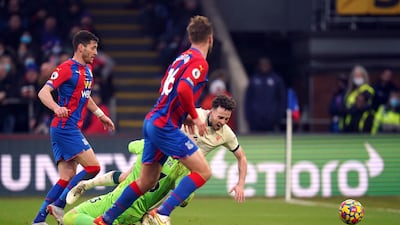 Liverpool's Diogo Jota goes down under a challenge from Crystal Palace goalkeeper Vicente Guaita and a penalty is awarded after a VAR check. PA