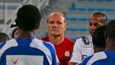 The UAE coach Dominique Bathenay, in red, with his players, at Al Maktoom Stadium.
