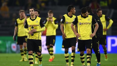 Borussia Dortmund players react after being eliminated from the Champions League on Tuesday. Patrik Stollarz / AFP / April 8, 2014