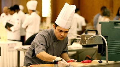 A Chef taking part in the cake competition in the East Coast Culinary Competition. Pawan Singh / The National