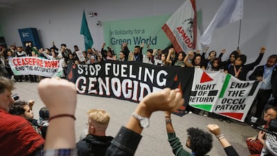 Climate Justice Coalition activists take part in a pro-Palestinian protest at Cop29. Reuters