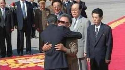 China's premier, Wen Jiabao, left, hugs the North Korean leader Kim Jong Il upon his arrival in Pyongyang for talks yesterday.