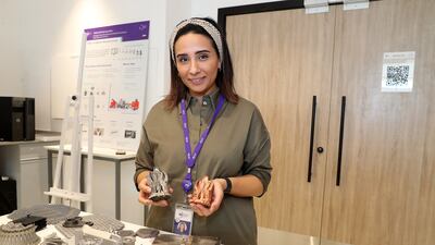 Nesma Aboulkhair, director of additive manufacturing, shows 3D-printed items inside the lab at the Technology Innovation Institute in Abu Dhabi