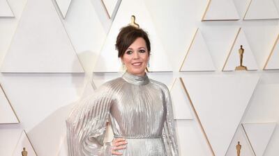 Olivia Colman, wearing a draped metallic gown. AFP