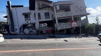A collapsed building is seen after a 7.8 magnitude earthquake in General Santos City in Philippines. AFP