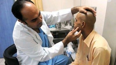 Indian cancer patient Brijender Singh is examined by Dr Pankaj Chaturvedi during a routine check-up at the Tata Memorial Hospital in Mumbai. The western Indian state of Maharashtra, of which Mumbai is the capital, has become the fourth state this year to outlaw “gutka” chewing tobacco.