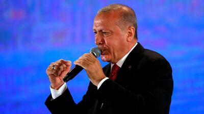 Turkish President Tayyip Erdogan addresses his supporters during a ceremony marking the third anniversary of the attempted coup at Ataturk Airport in Istanbul, Turkey, July 15, 2019. Reuters