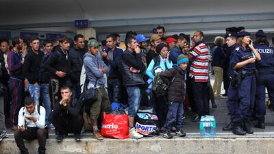 Migrants wait for a train in the Austrian capital Vienna, in 2015. Getty Images