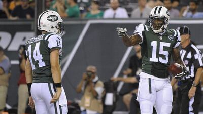New York Jets wide receiver Brandon Marshall, right, gestures to quarterback Ryan Fitzpatrick during their pre-season NFL game against the Atlanta Falcons on Friday night. Bill Kostroun / AP / August 21, 2015