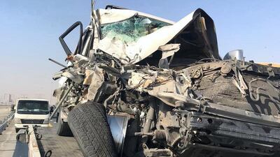 The driver of a Land Cruiser was severely injured after he rammed into a pickup truck that was parked wrongly in the middle of the road. Courtesy: Dubai Police