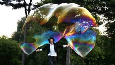 'You can never get bored of bubbles,' says Samsam Bubbleman, seen here with the record-breaking free-floating bubble he created in 2009. Courtesy SamSam Bubbleman