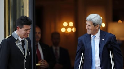 US Secretary of State John Kerry talks to a hotel staff member as he leaves his hotel on the way to mass at the St Stephen's Cathedral in Vienna. World powers raced to clinch a landmark deal to prevent Iran acquiring a nuclear bomb, with diplomats saying an agreement would be announced on Monday. AFP PHOTO