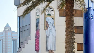 Yasser Tycir, a salon worker from the area, believes residents and businesses have been given a lift by the new artwork. Tom Dulat / Getty Images