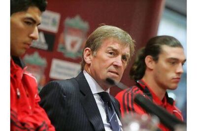 Former Liverpool manager Kenny Dalglish, centre, is flanked by Luis Suarez, left, and Andy Carroll. The strikers were brought to Anfield using money from the £50 million sale of Fernando Torres to Chelsea. Getty Images