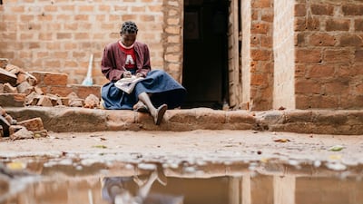 12-year-old Aladina Zacarias outside her home in Zambezia, Mozambique, which was destroyed by Cyclone Freddy. AP