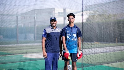 Nilansh Keswani alongside coach Qasim Ali.