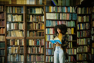 Reading releases dopamine steadily, helping to retrain your brain’s reward system by focusing on sustained gratification over time. Getty Images