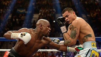 Floyd Mayweather Jr, left, did not have a straightforward win over Marcos Maidana. Harry How / Getty Images