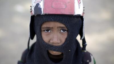 Indonesian child jockey Egi, 8, poses for a photograph before he participates in a horse race marking Indonesia’s 70th independence anniversary, in Bima. Mast Irham / EPA