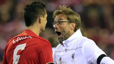 Liverpool manager Jurgen Klopp, celebrates with Dejan Lovren after the defender scored a later winner against Borussia Dortmund in the Europa League quarter-final second leg. Jon Super / AP Photo