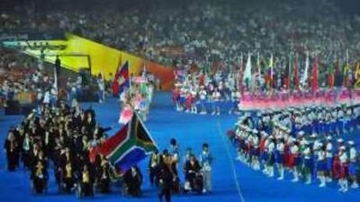 Natalie du Toit carries the flag for the South African Paralympic team in Beijing, just as she did for the able-bodied Games last month, becoming the first person to do so.