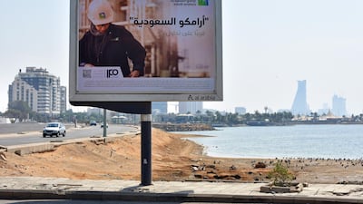 An advertisement advertising the planned Saudi Aramco initial public offering sits on display at the corniche coastline in Jeddah, Saudi Arabia. Bloomberg