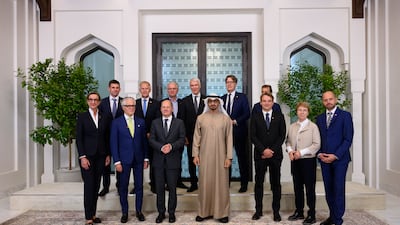 Sheikh Mohamed and Olaf Scholz pose for a photograph with the German Economic delegation, after a meeting at Al Shati Palace. Photo: UAE Presidential Court