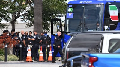 Officials of the US Customs and Border Protection (CBP) check the paperwork of members of the Iranian national football team after landing at Los Angeles International Airport on June 14, 2026. AFP