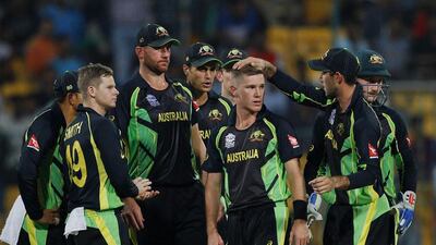 Australia’s Adam Zampa, third right, celebrates with teammates the dismissal of Bangladesh’s Shuvagata Hom during their ICC World Twenty20 match at Bangalore, Monday, March 21, 2016. Aijaz Rahi / AP Photo