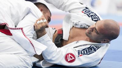 Lucio Rodrigues, left, fights Andre Campos, during a Male Adult Open Weight match at Al Ain Jiu Jitsu Open Championship. Reem Mohammed / The National
