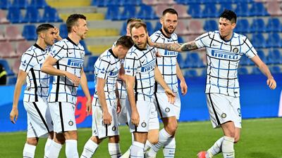 Christian Eriksen, centre, celebrates after scoring the opening goal for Inter Milan in their 2-0 Serie A win against Crotone at the Ezio Scida Stadium on Saturday, May 1. AFP