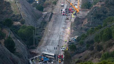 Emergency personnel gather at the site of a high-speed train collision that killed more than 40 people, in southern Spain. AFP