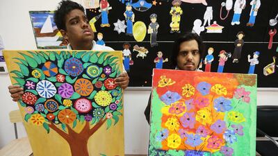 Students from Future Centre for Special Needs Waseef Khandaker, left, and Yousef Jawdar raised Dh50,000 for the centre in March 2014 with their artworkd. Sammy Dallal / The National