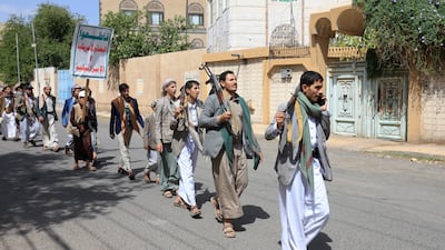 Houthi fighters march to recruit more fighters in Sanaa, Yemen, on Friday. EPA