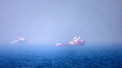 Ships in the Strait of Hormuz off the eastern coast of the UAE in July. AFP