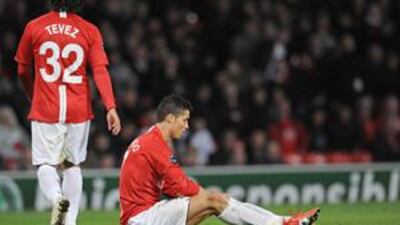 Cristiano Ronaldo sits dejected on the floor after Manchester United were held to a 2-2 draw by Porto at Old Trafford last night.