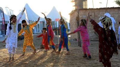 Children dance a stall. Ravindranath K / The National